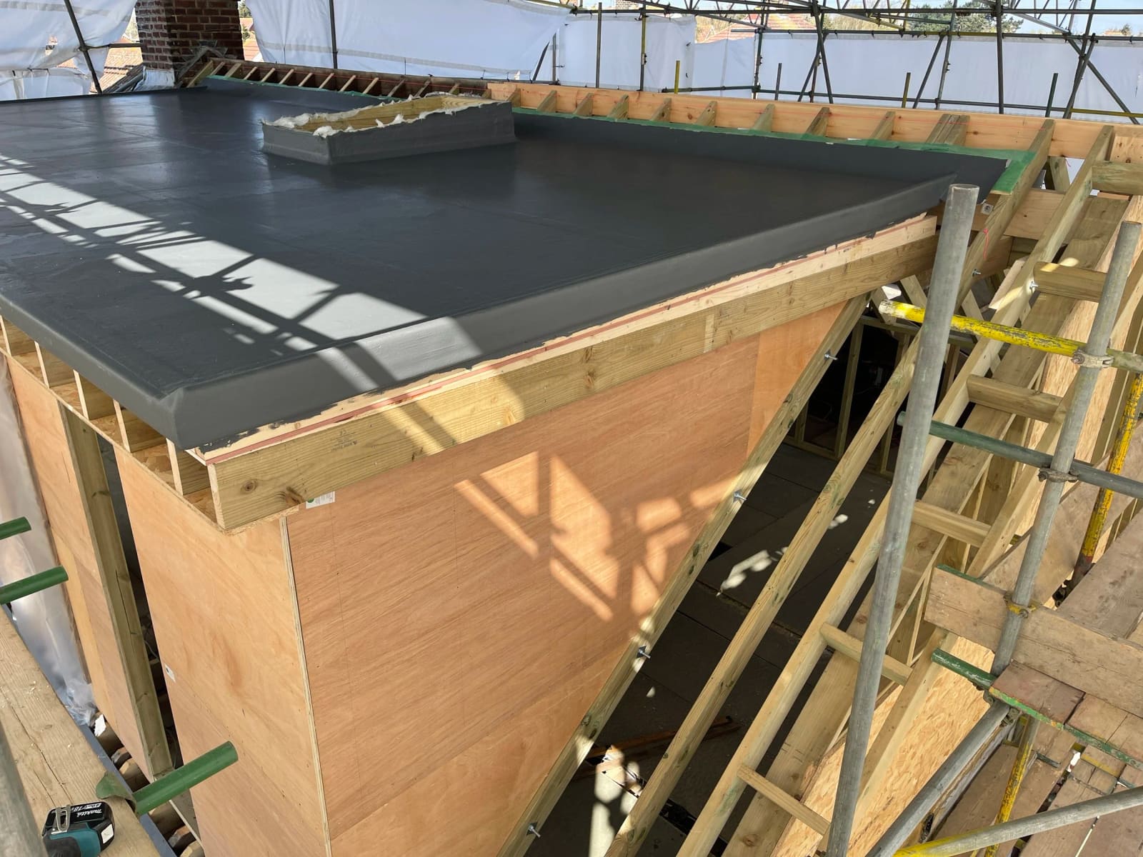 Fibreglass flat roof under construction in Grays